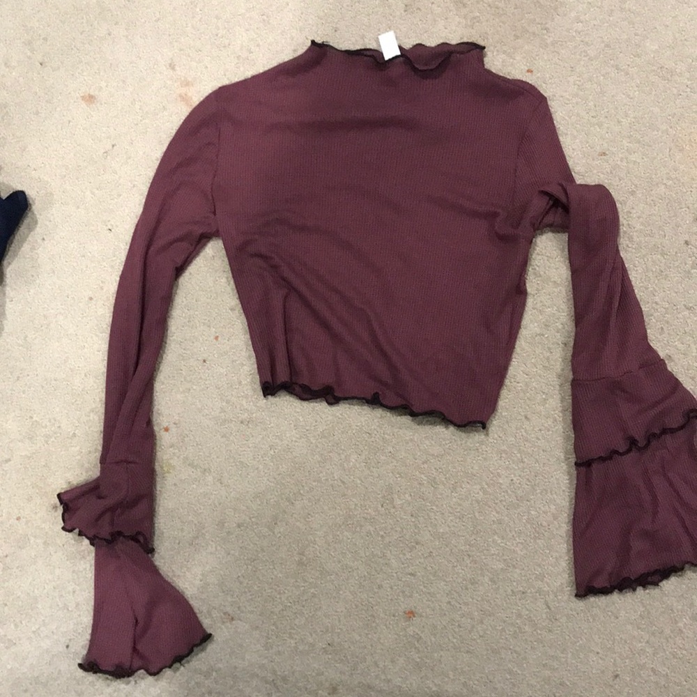 maroon cropped shirt with black lettuce trim